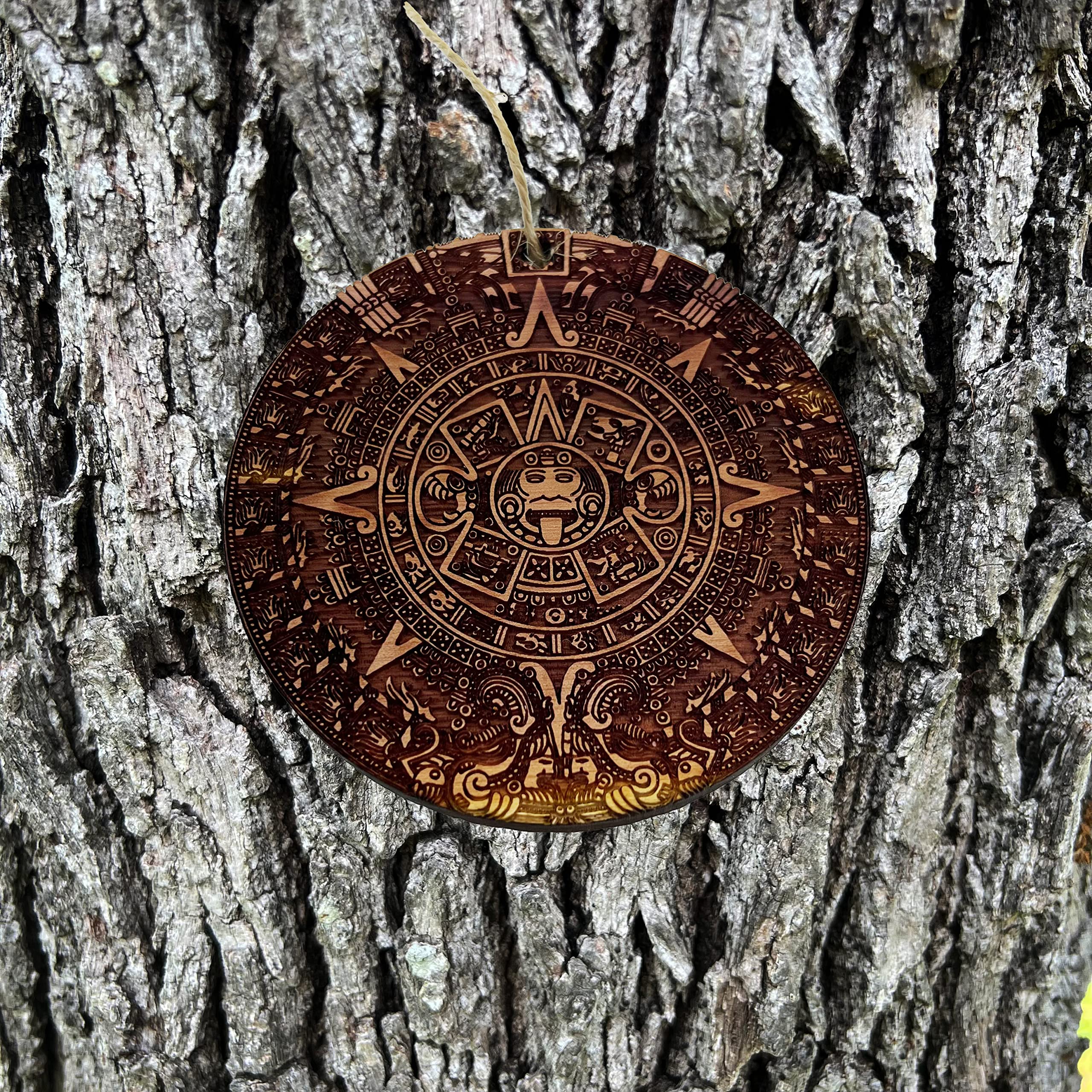 Front side sanded cedar ornament with engraved calendar design