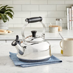 Le Creuset enamel on steel kettle showing min and max fill markings