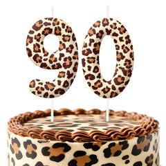 Leopard print number 90 birthday candles on cake