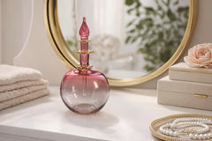 Les Trois Pyramides handblown red perfume decanter 14K gold accents close view