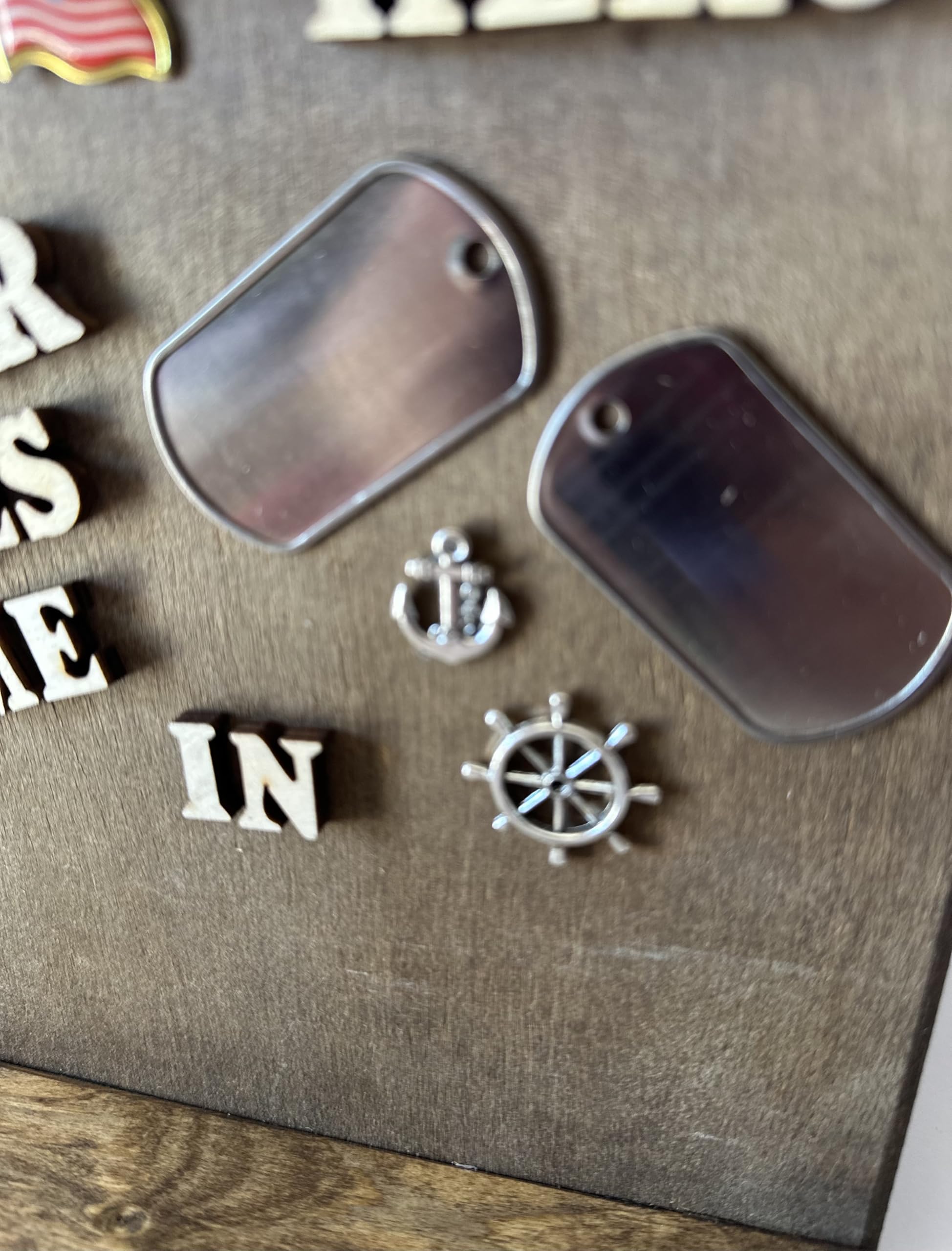 Embellishments including two dog tags US Flag anchor and wheel