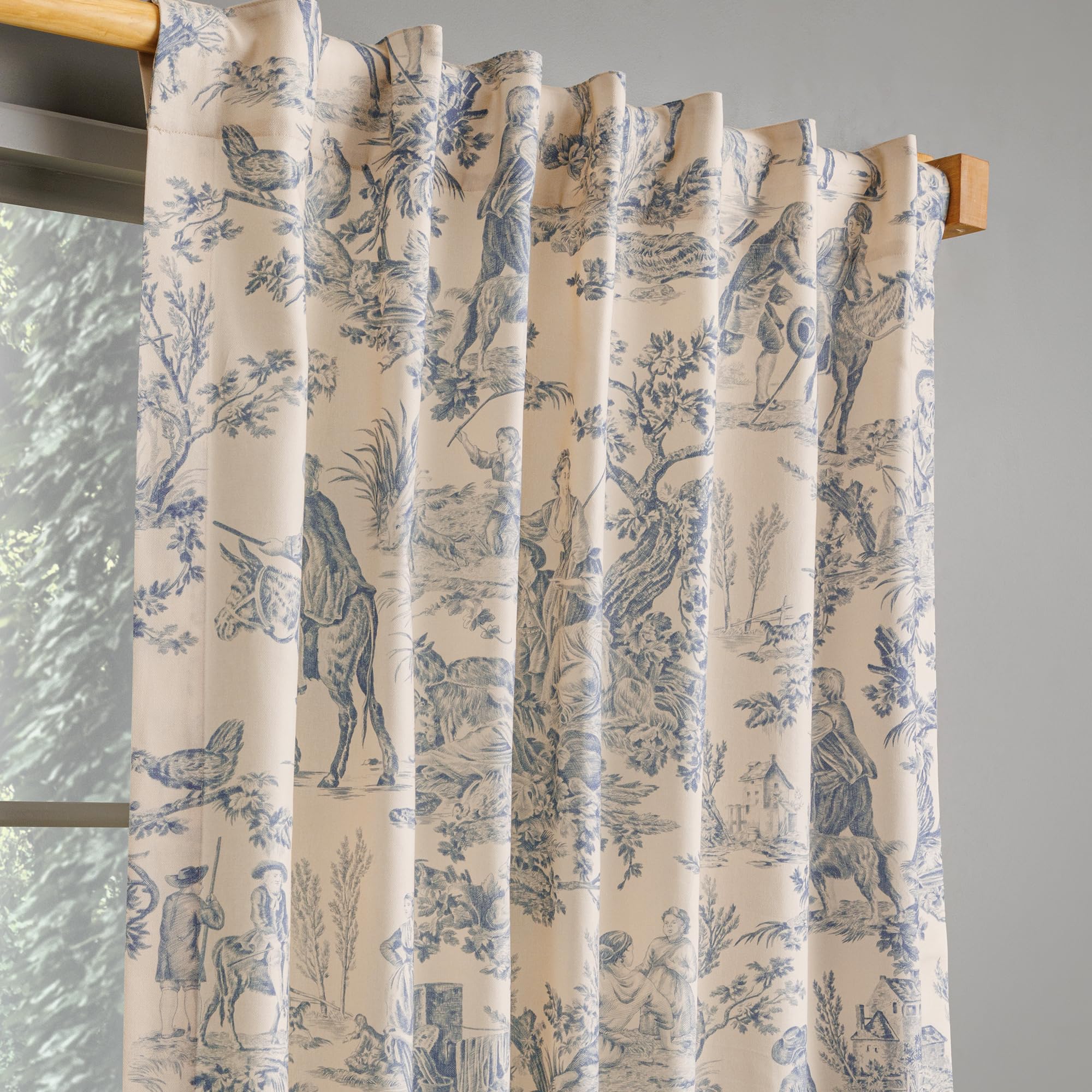 Toile print curtain in living room setting