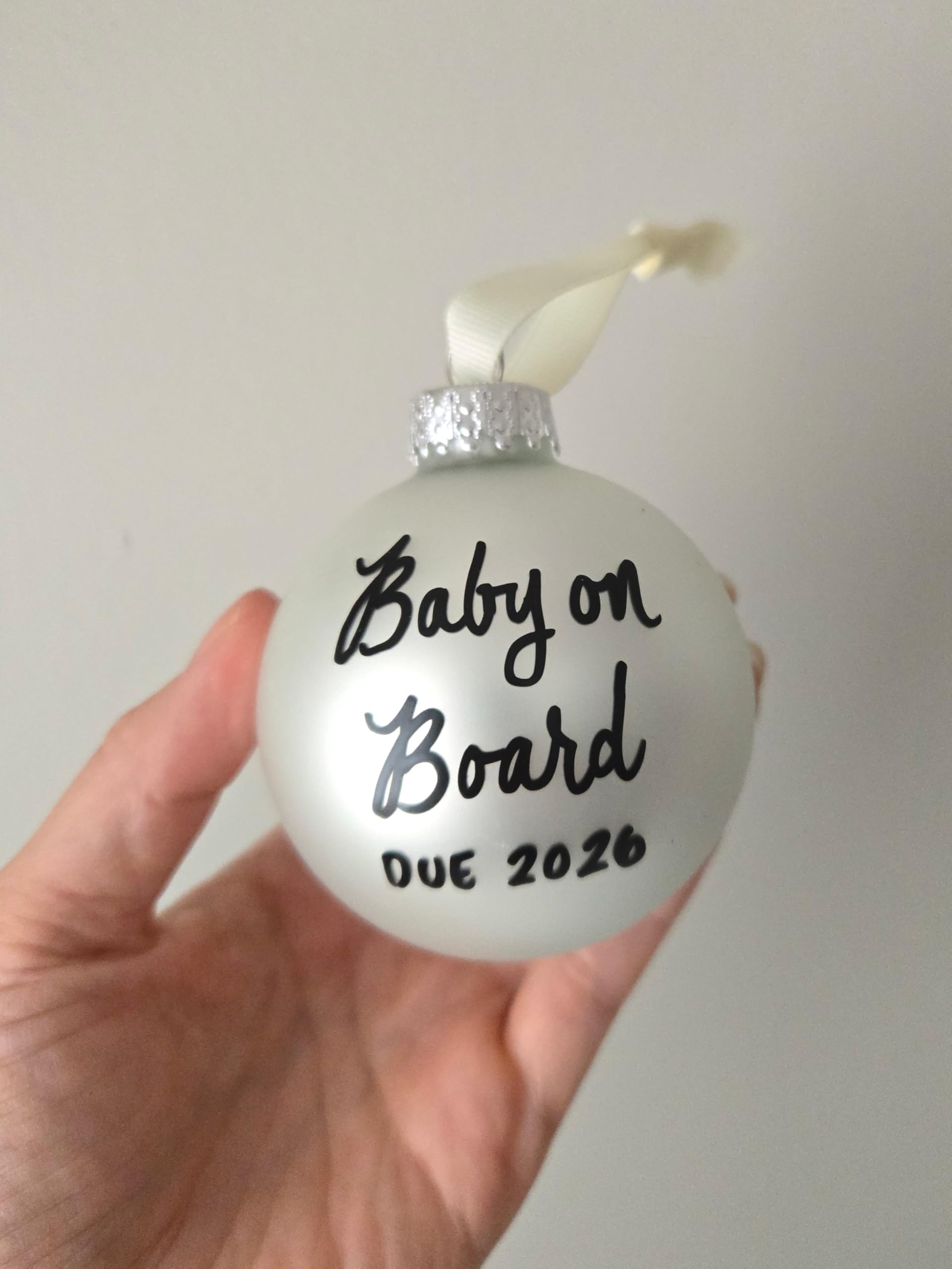 Hand lettered with Baby on Board Due 2025 on ornament
