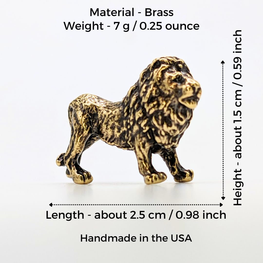 Miniature brass lion sculpture on display shelf