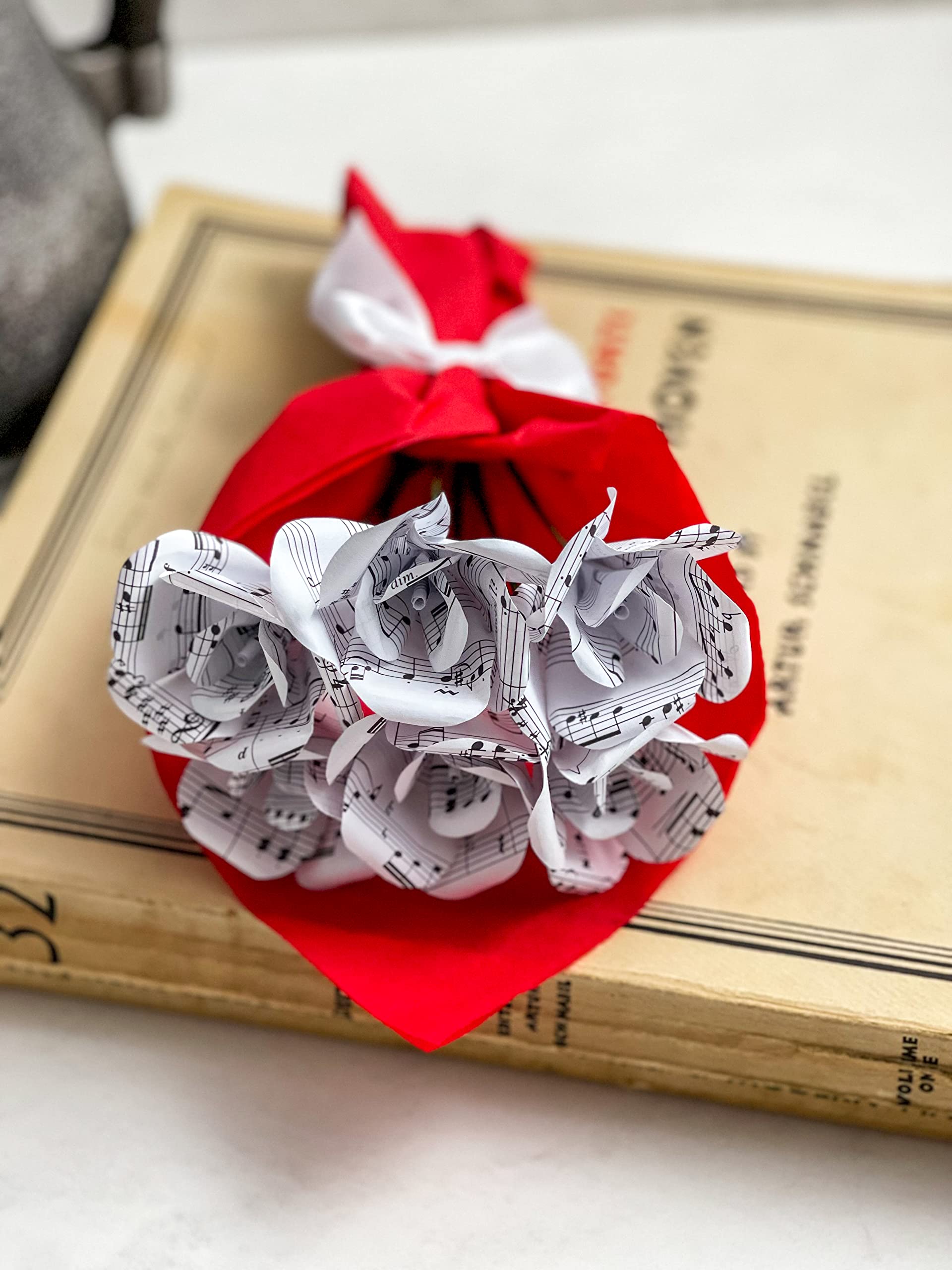 Six mini roses handcrafted from recycled sheet music