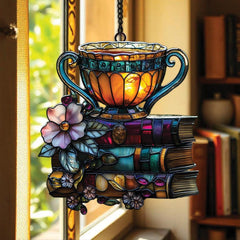 Literary decor ornament featuring floral book and teacup motif