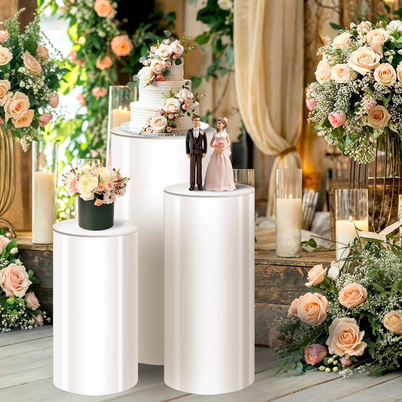 Three white cylinder pedestal stands in sizes 35.4 29.5 23.6 inches for party displays