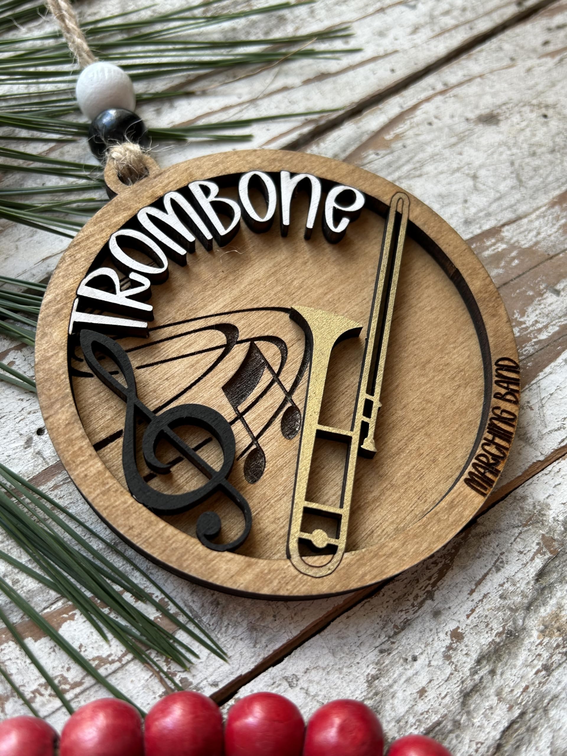 Includes 2 wood beads and twine for hanging on tree