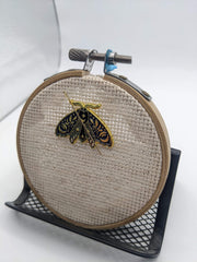 Needle rests on magnet when taking a break with Midnight Moth Needle Minder