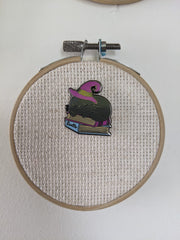 Back magnet secures needle minder to fabric