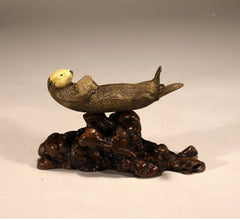 Signed sea otter sculpture with certificate of authenticity