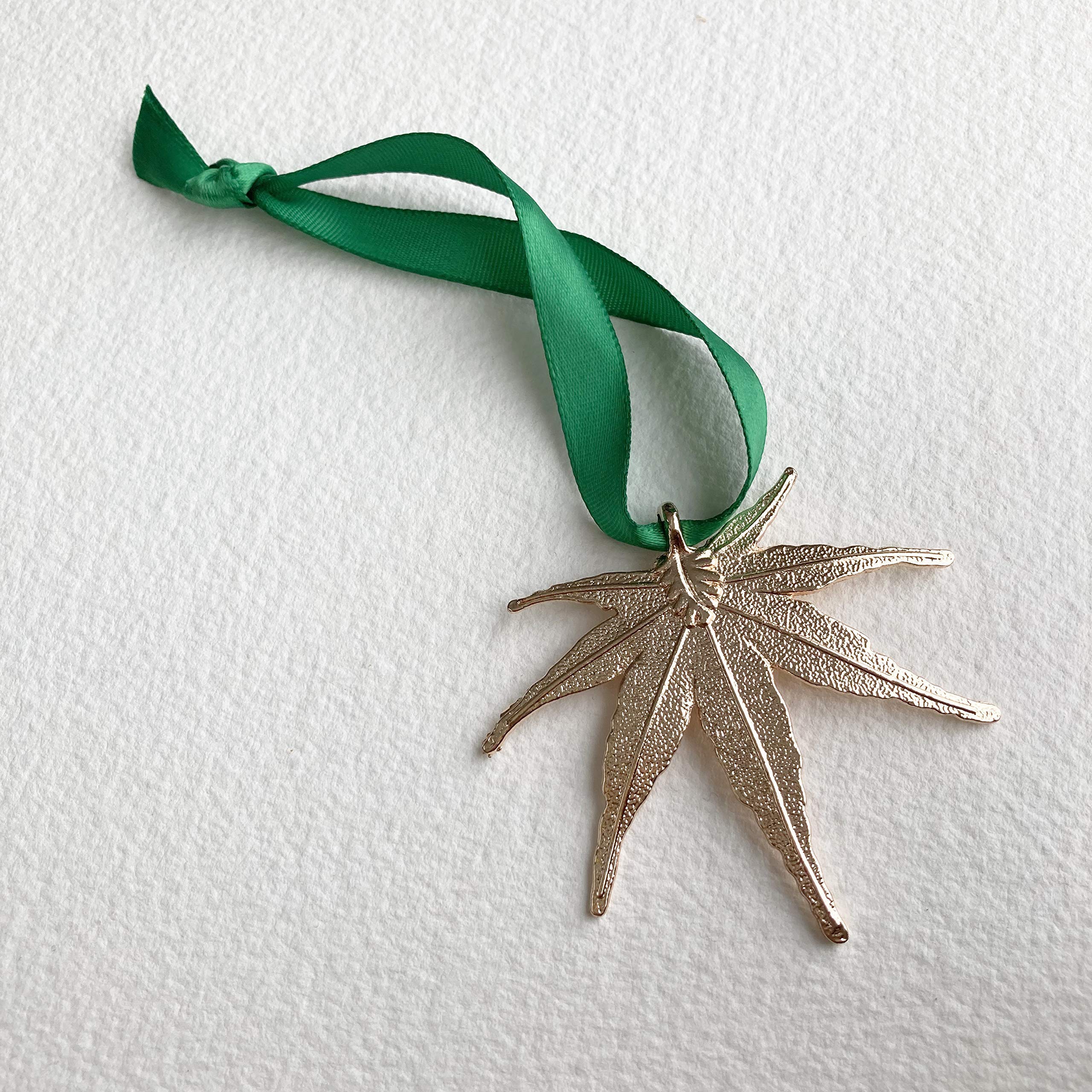Metal leaf ornament for cannabis lovers with gold finish