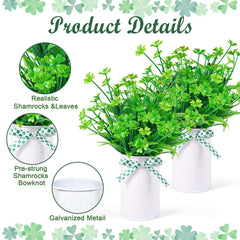 White mason jars with green bows for centerpiece