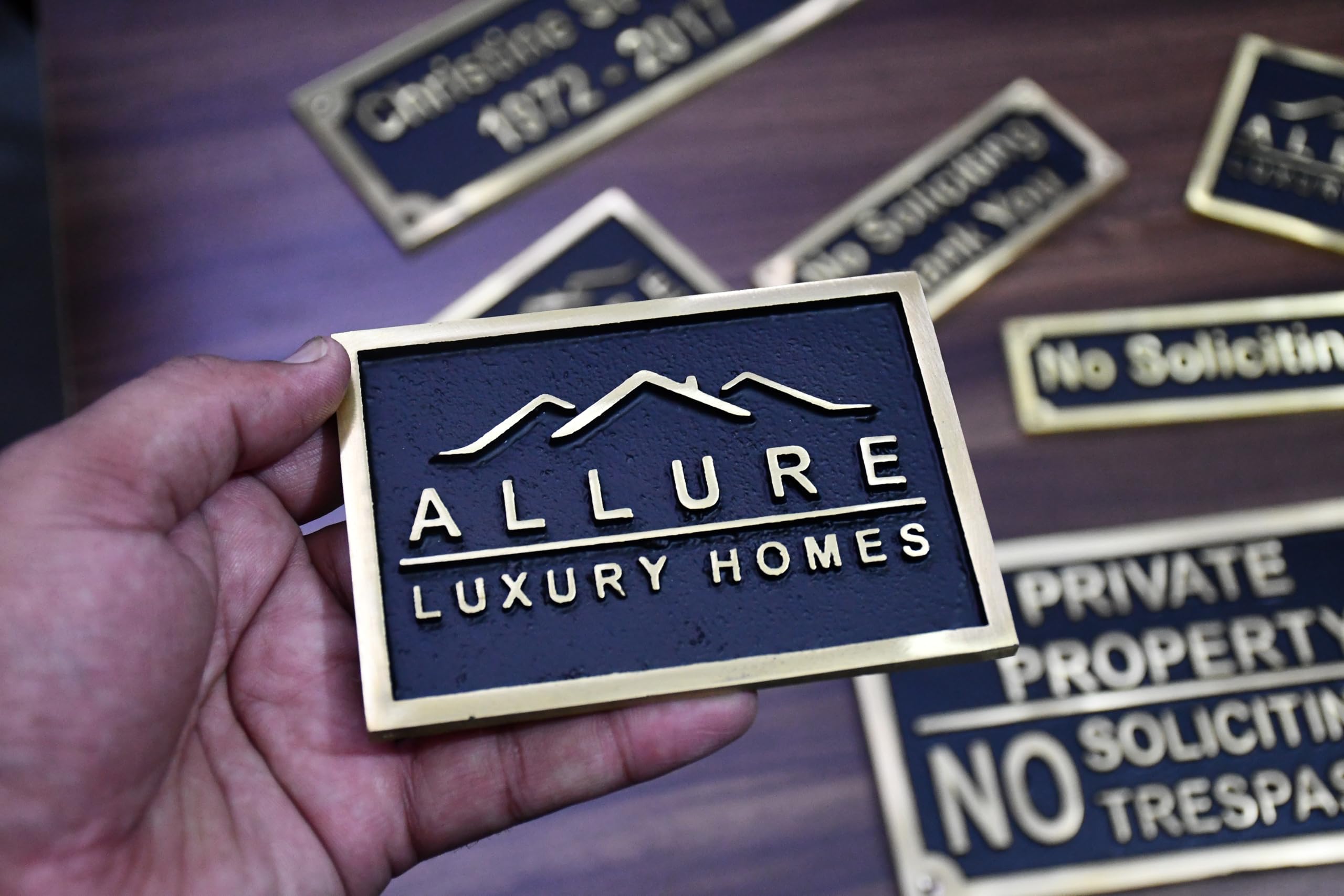 Brass plaque with mounting screws