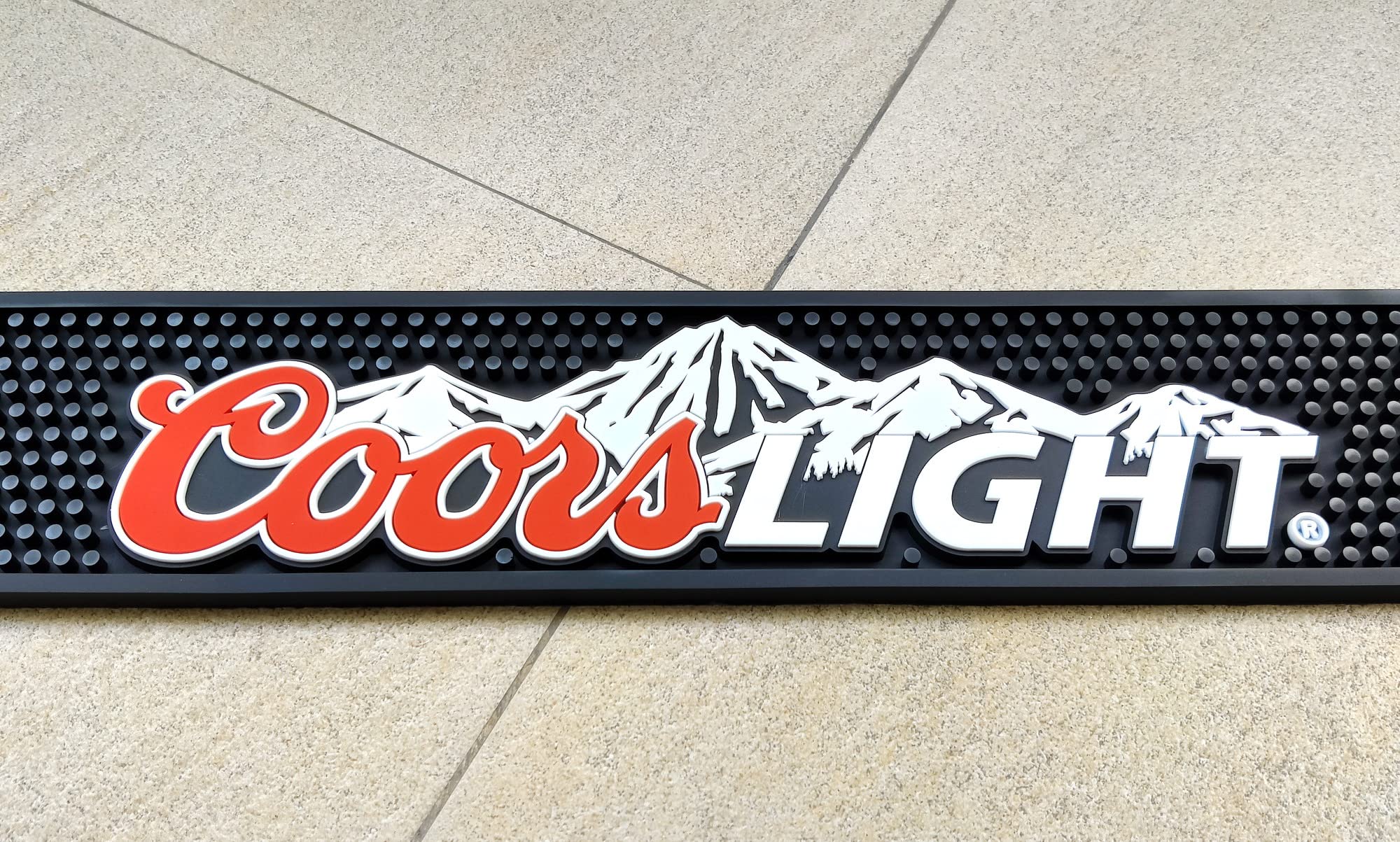 bar mat with coors branding on countertop