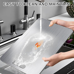 Easy to clean cutting board shown with water and knife