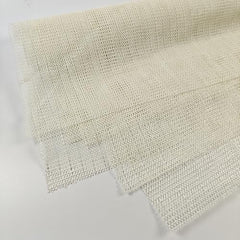 Mesh textured anti slip pad for tables and rugs