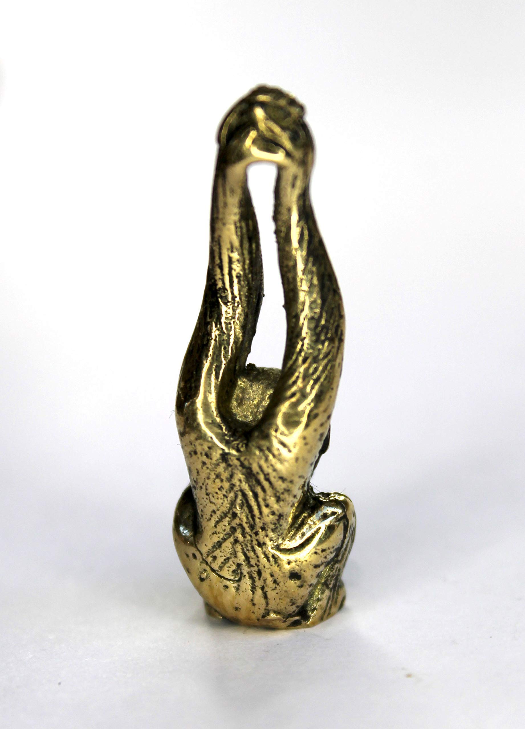 Metal figurine monkey with raised hands