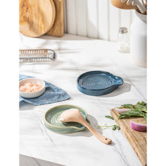 Heavyweight ceramic spoon holder with raised edges