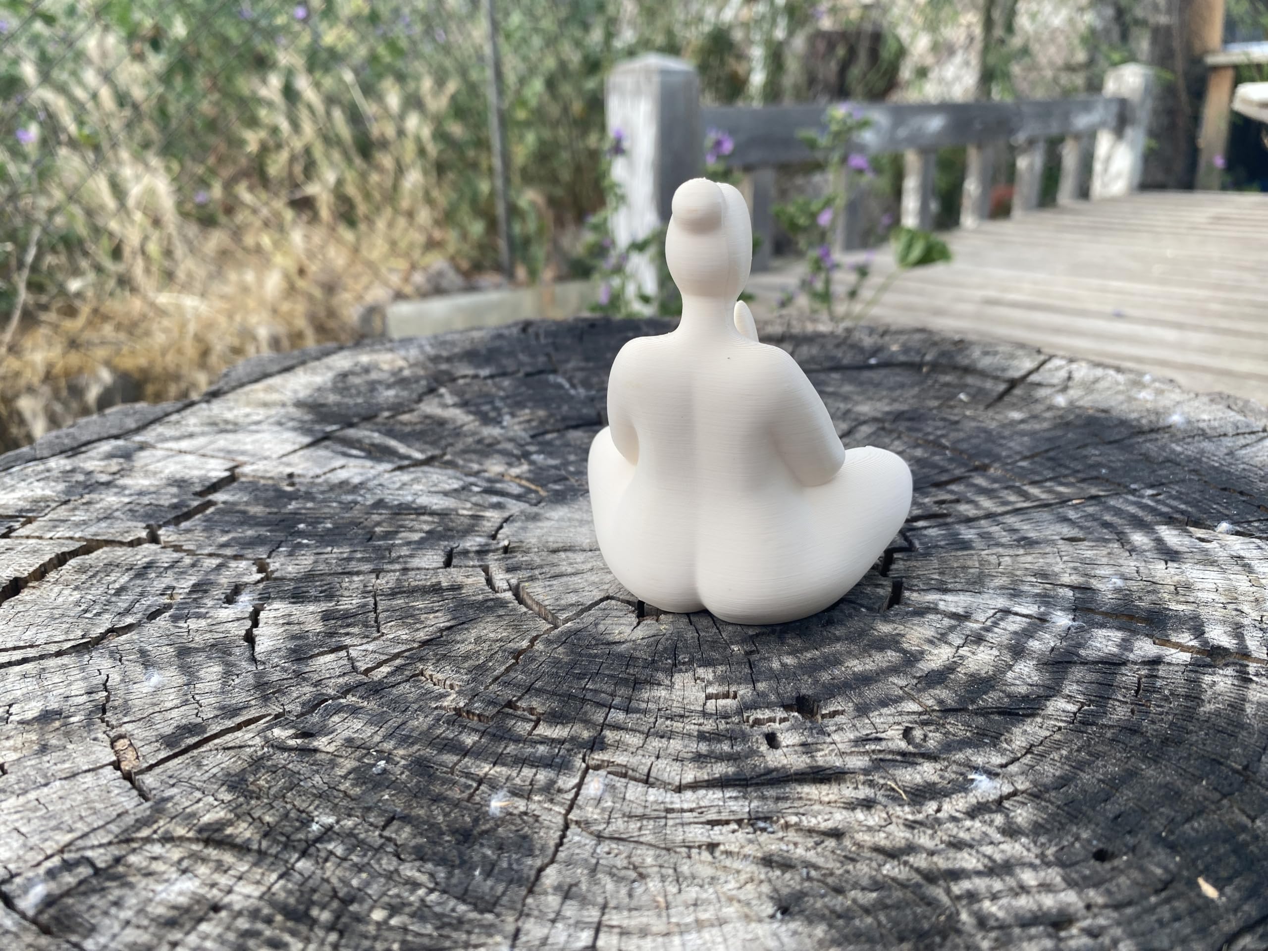 Mindfulness statue on a desk to encourage focus