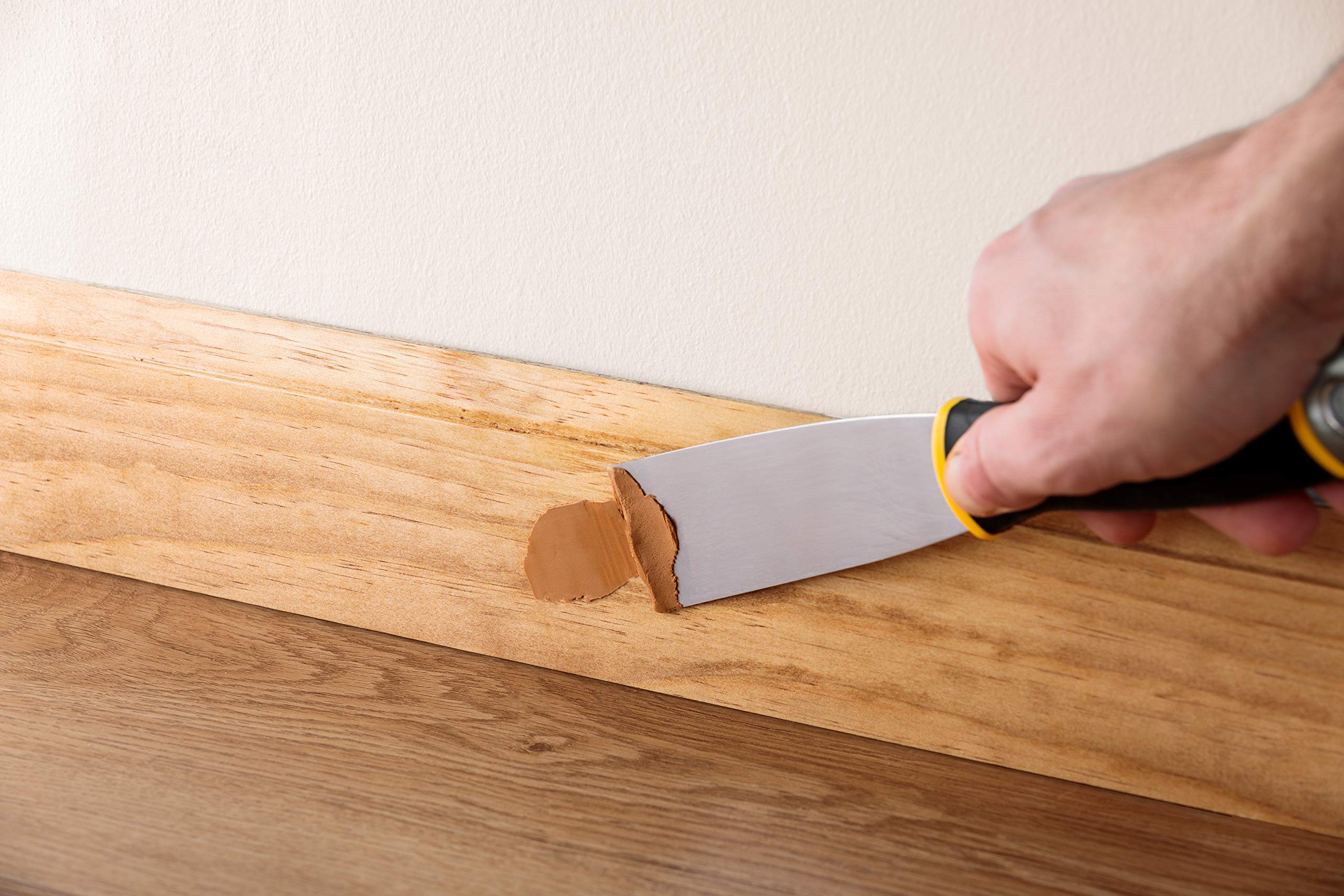 Non-hardening wood filler for nail holes