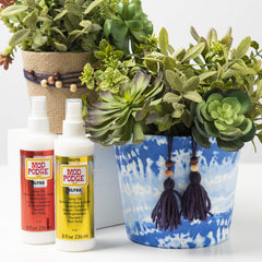 Mod Podge Ultra Matte Spray On Sealer applied to wood craft surface