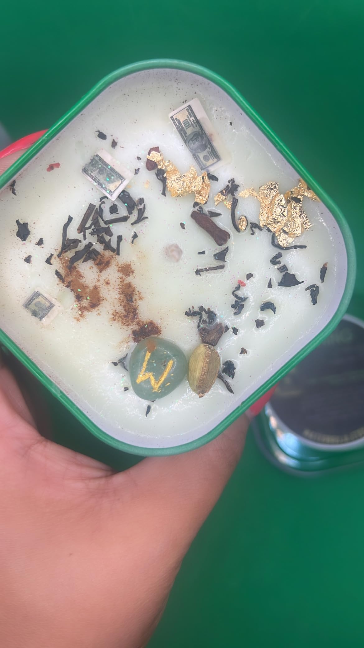 Green aventurine tumblestone rune on candle