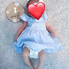 Wooden milestone discs with laser-engraved daisy pattern for baby photos