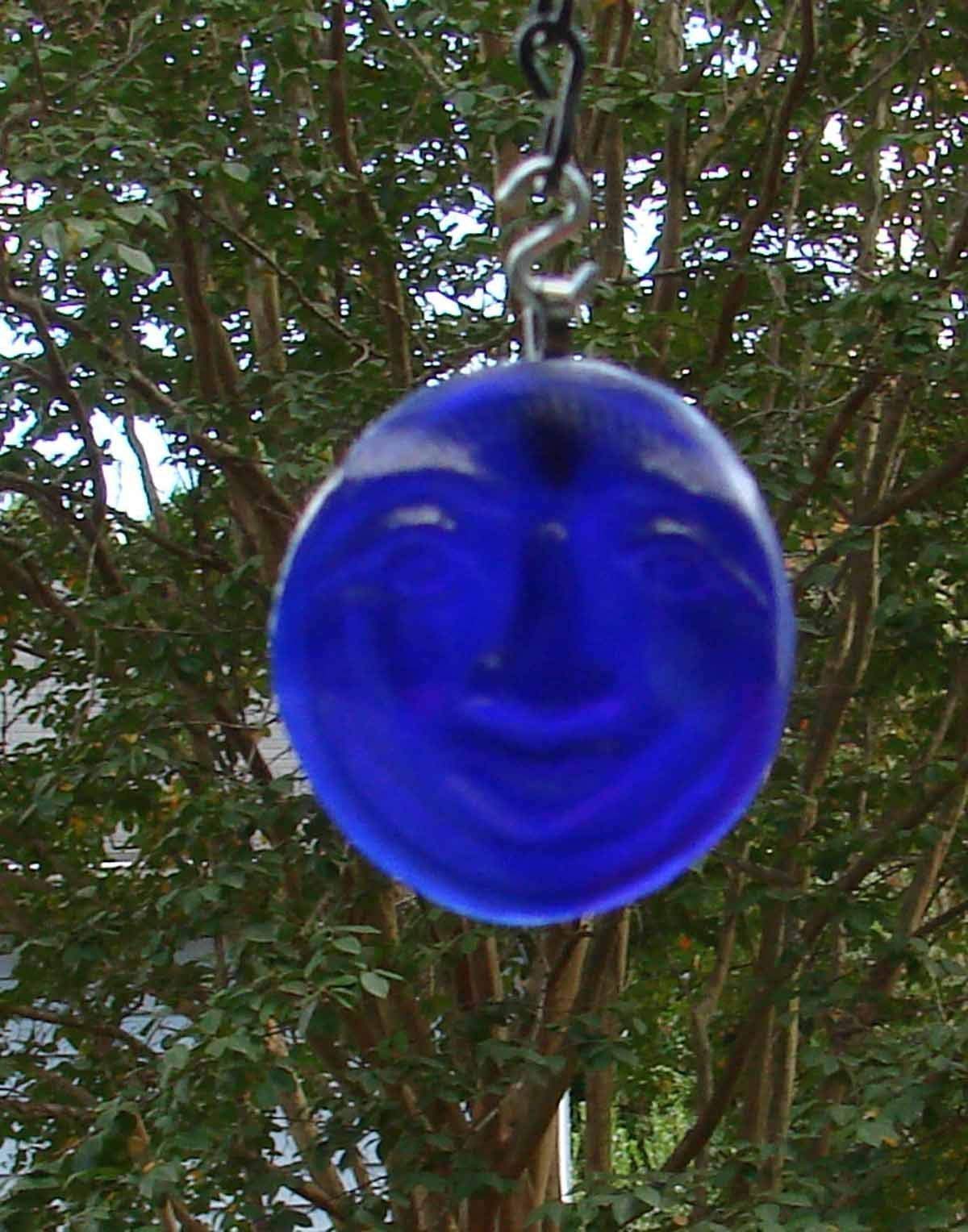 Moon design ornament from recycled bottle bottom