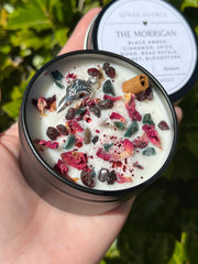 Cinnamon stick rose petals and essential oils on Morrigan candle