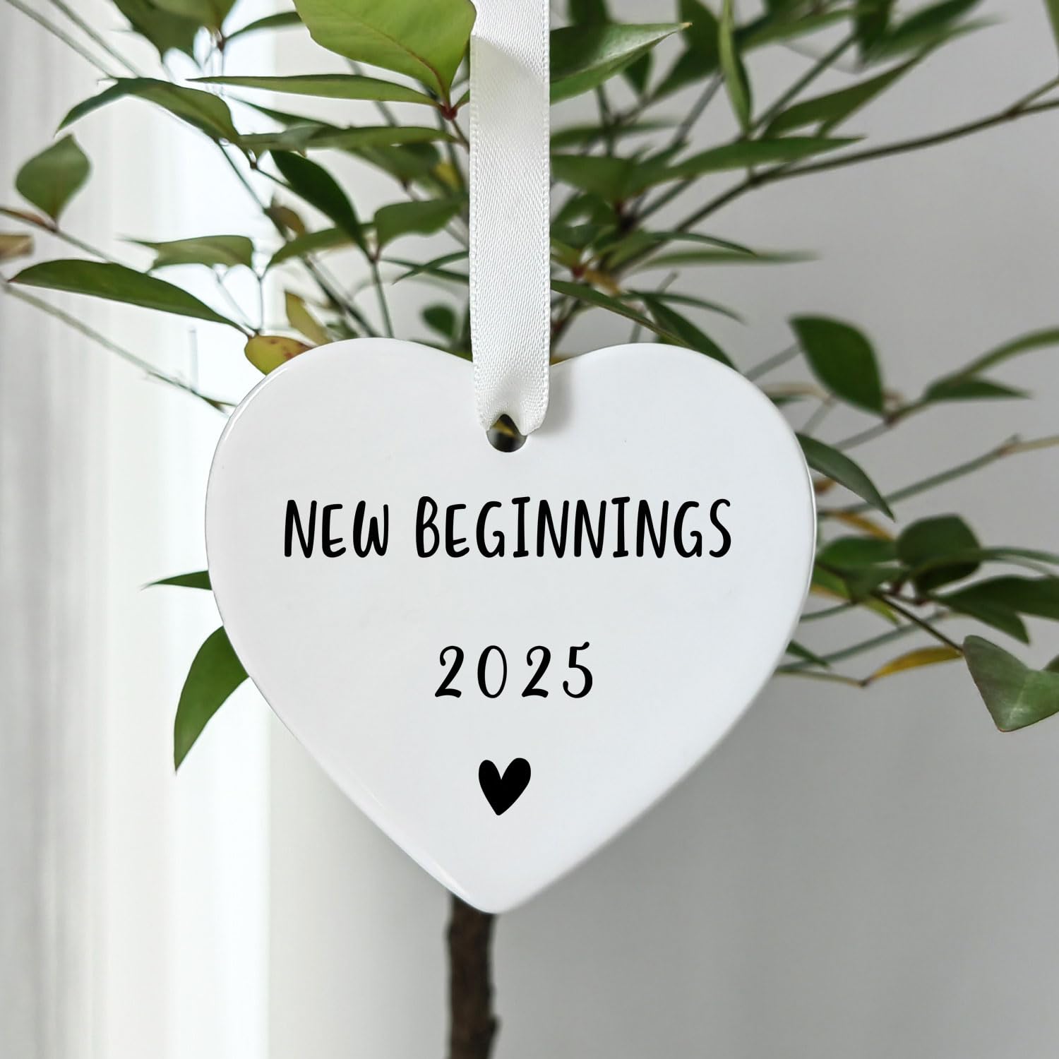 Gold hanging string and white ribbon included with heart ornament