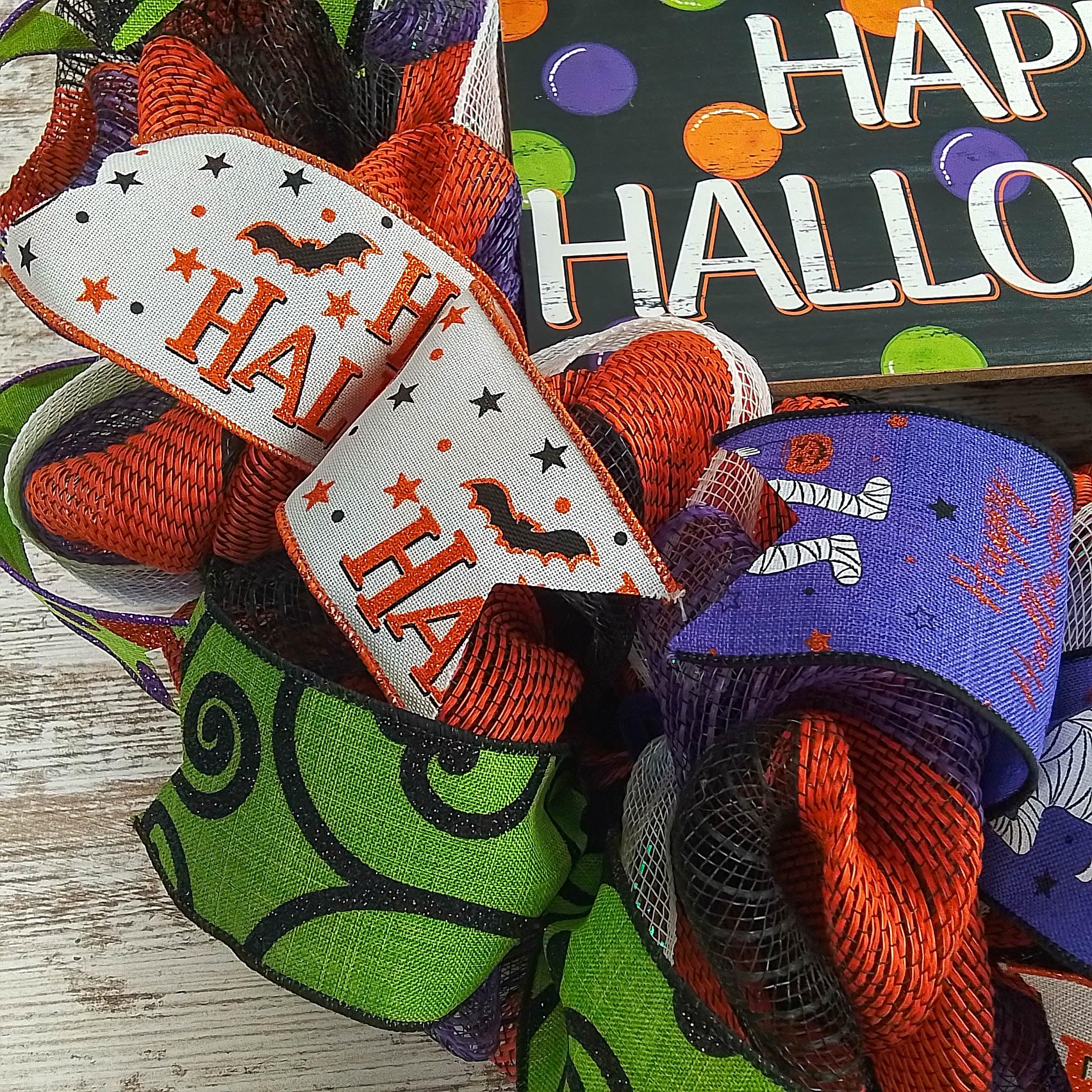 Removable Happy Halloween sign at wreath center
