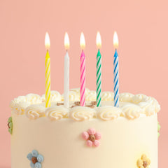 Assorted blue white yellow pink and green spiral candles