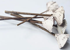Music notes paper rose on rustic wooden stick