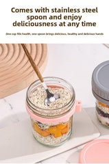 Jar with attached wooden spoon and screw top lid close up