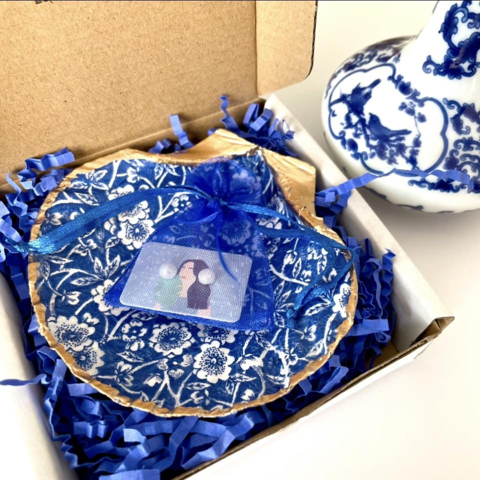 Blue chinoiserie seashell dish used as jewelry holder in home decor