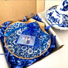 Blue chinoiserie seashell dish used as jewelry holder in home decor
