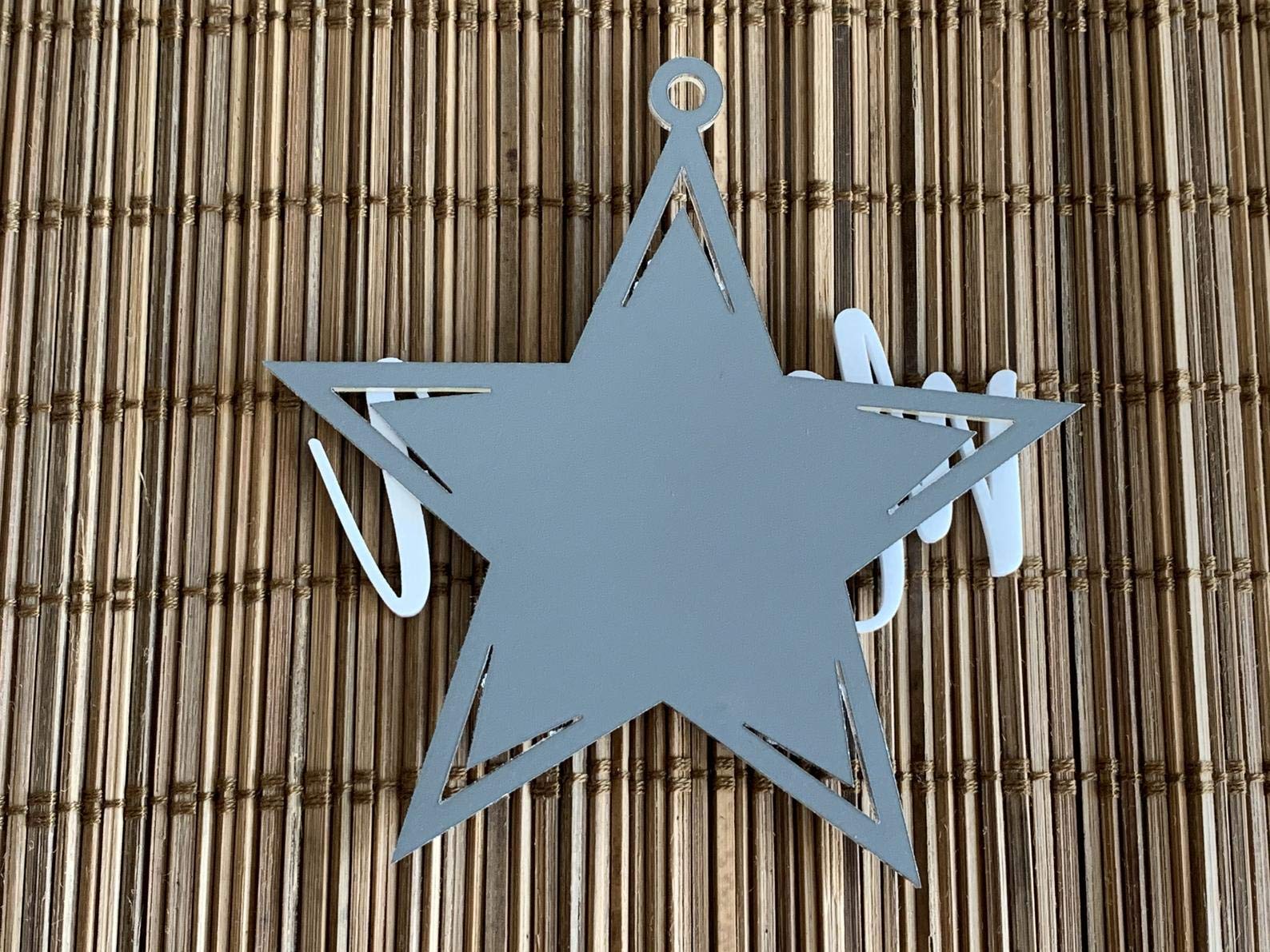 Colorful star ornament with laser cut name