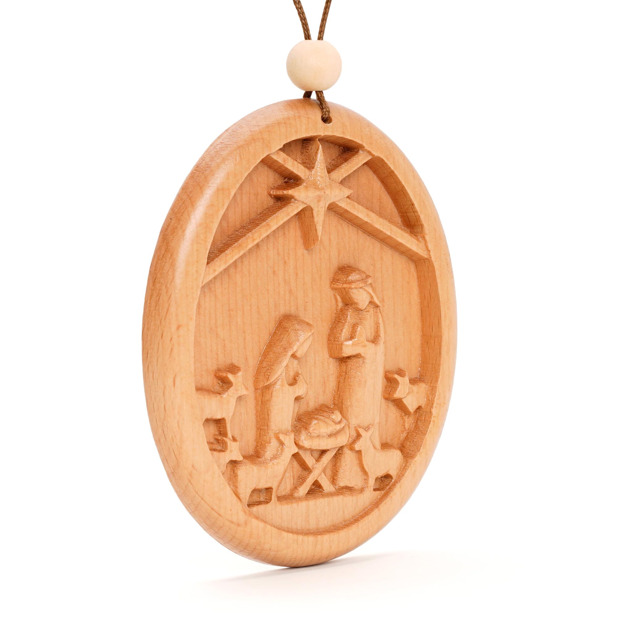 Handcrafted nativity ornament highlighting nativity scene