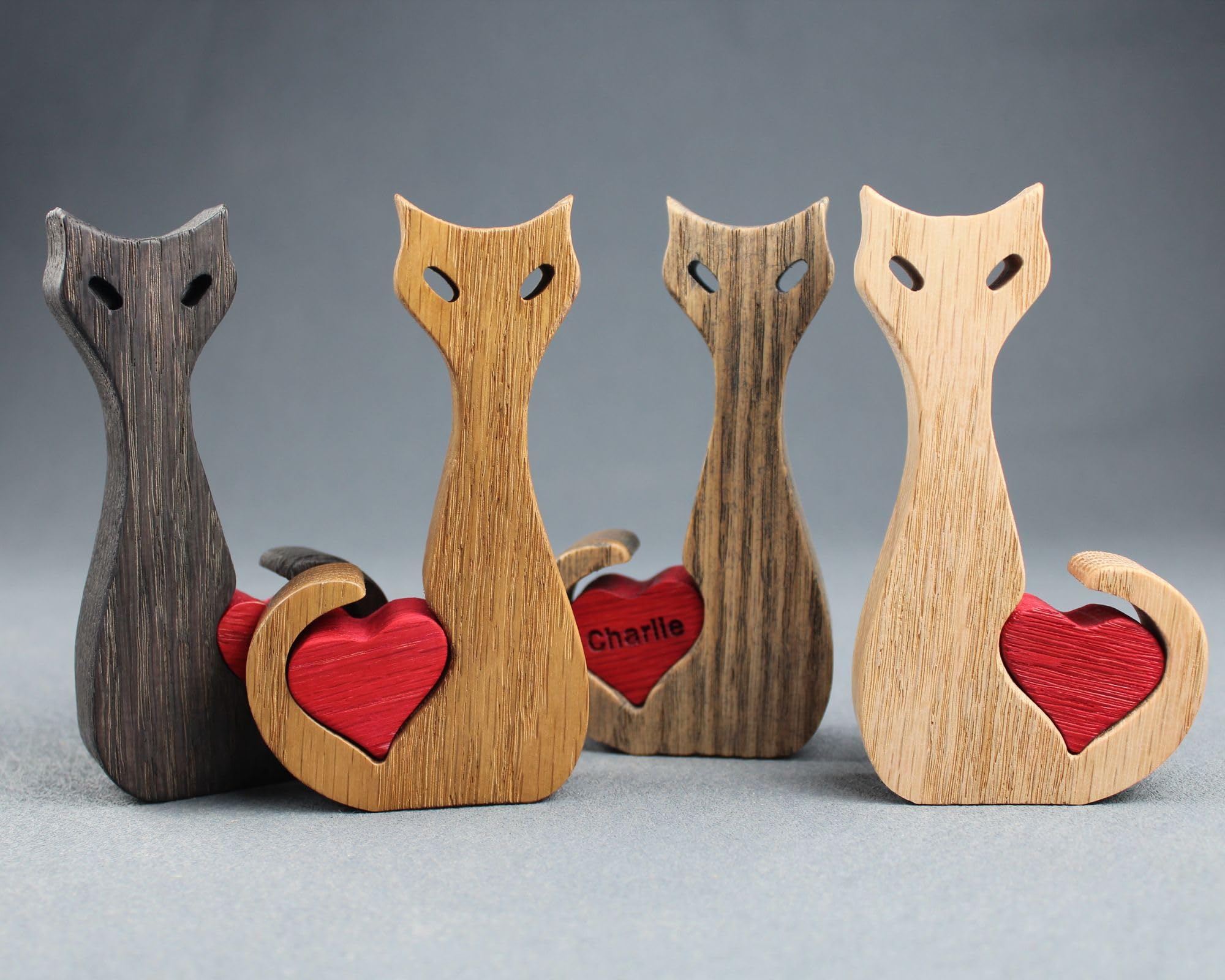 Natural oak cat figurine sized 4.5 by 2.5 by 0.75 inches