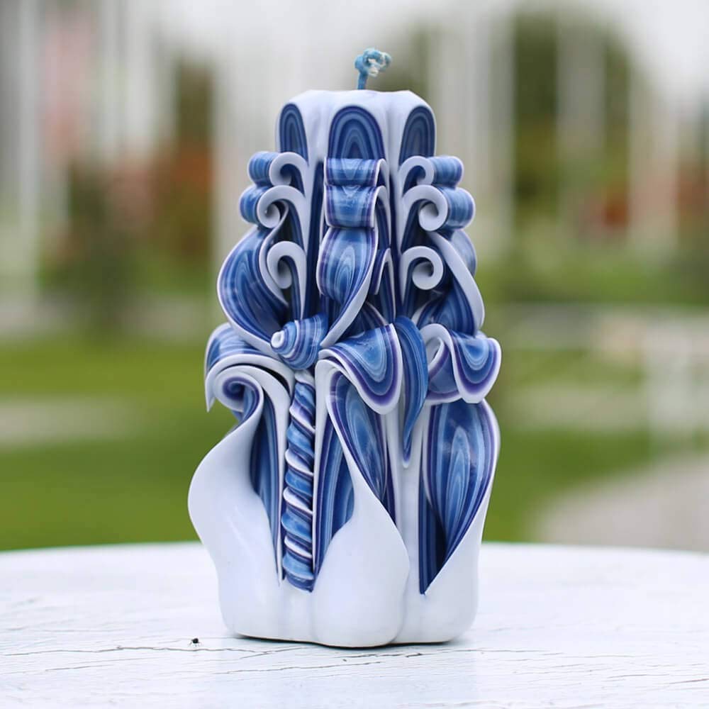 Ceramic vase like appearance of carved candle