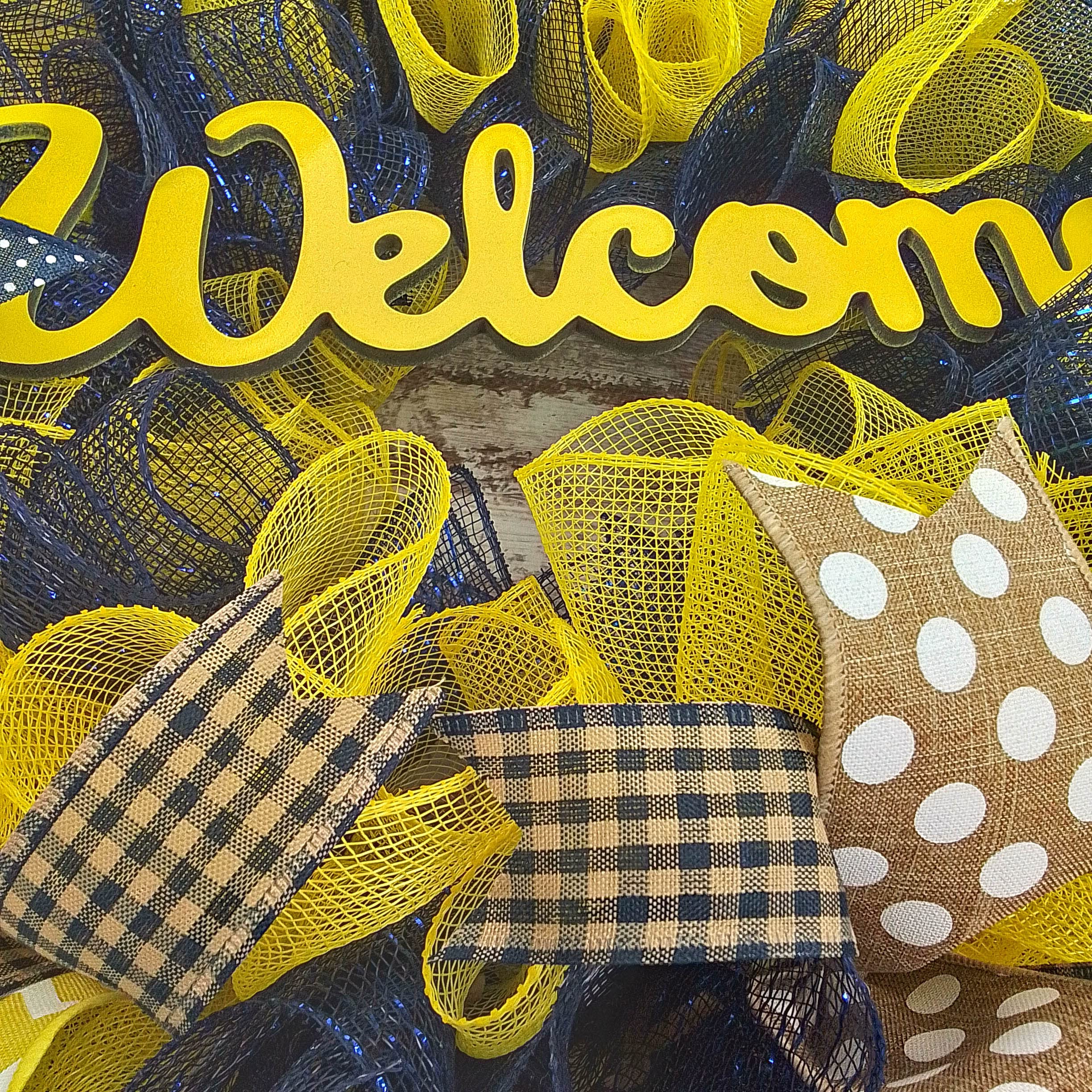 Navy blue and yellow mesh wreath with ribbons