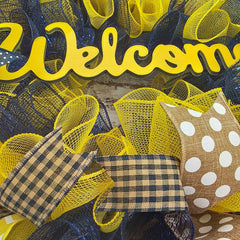 Navy blue and yellow mesh wreath with ribbons