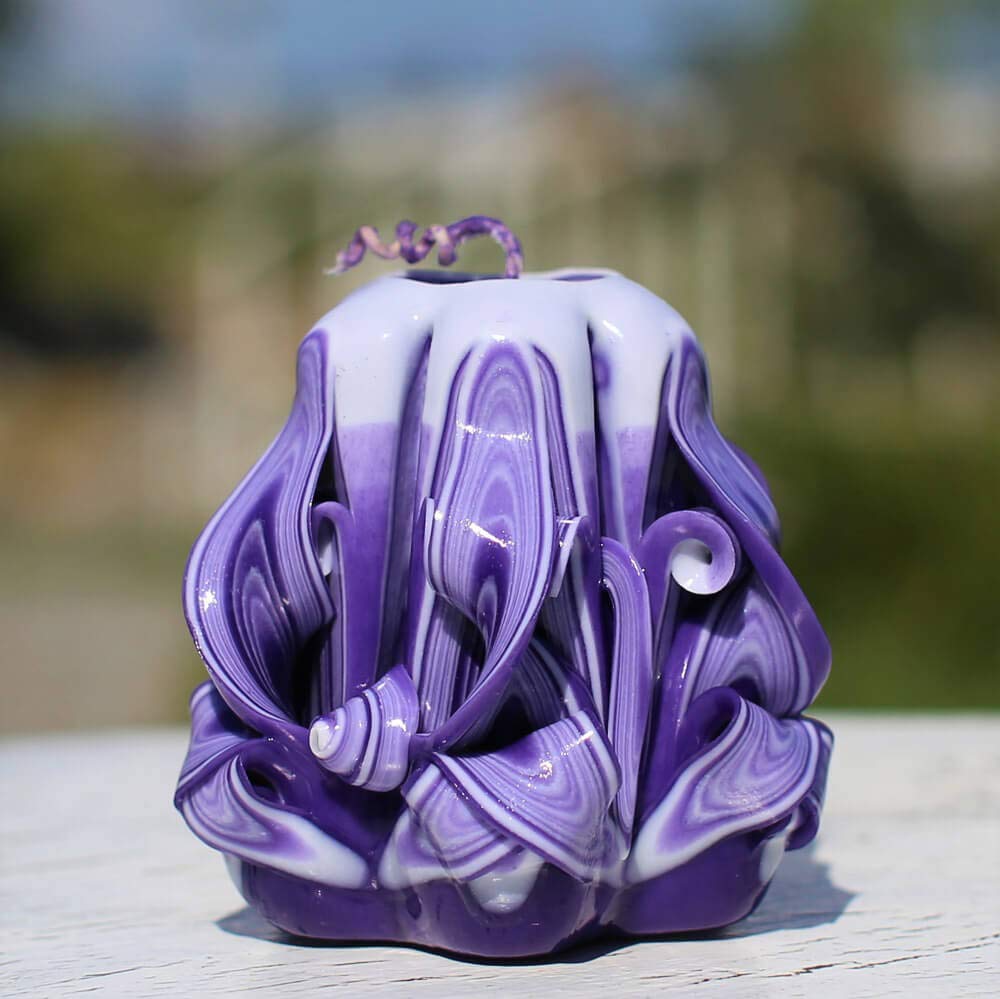 Blue purple tones carved candle resembling ceramic vase