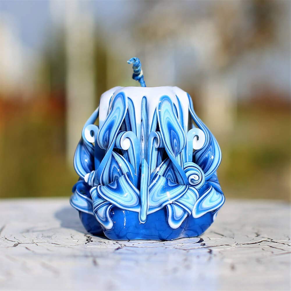 Navy stripe carved design on blue candle