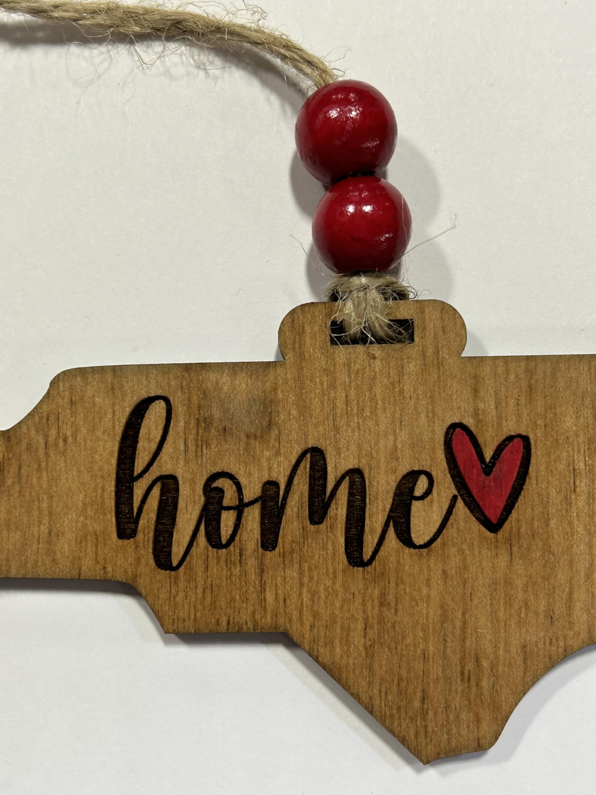 NC Home ornament laser cut and engraved in workshop
