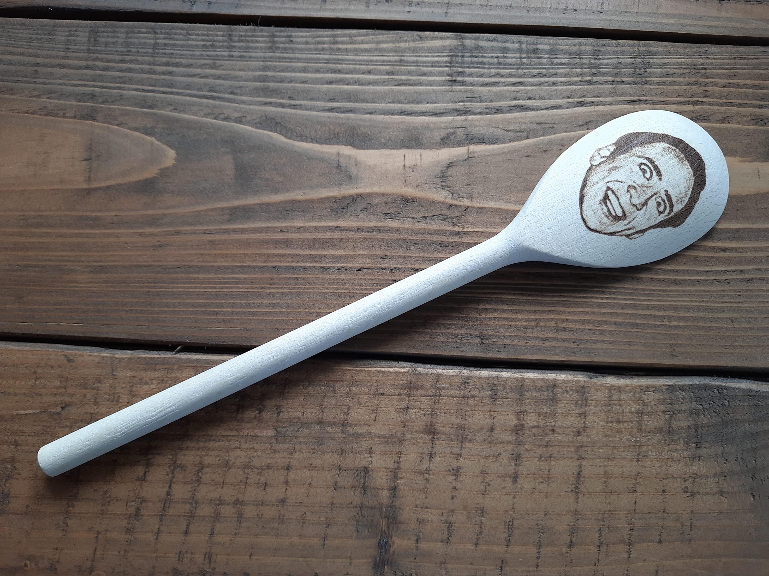 Wooden cooking spoon with Nicolas Cage engraving