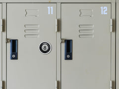 NJECT 8 Ball silver magnet attached to a filing cabinet