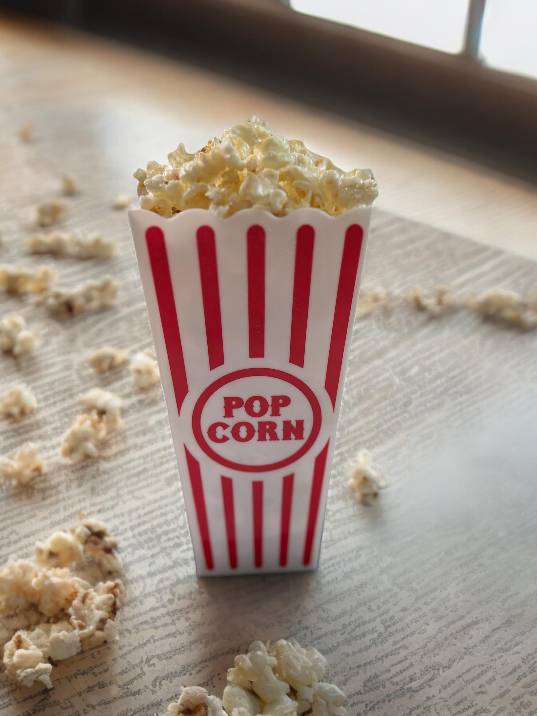 Not edible faux popcorn display in a sealed popcorn box