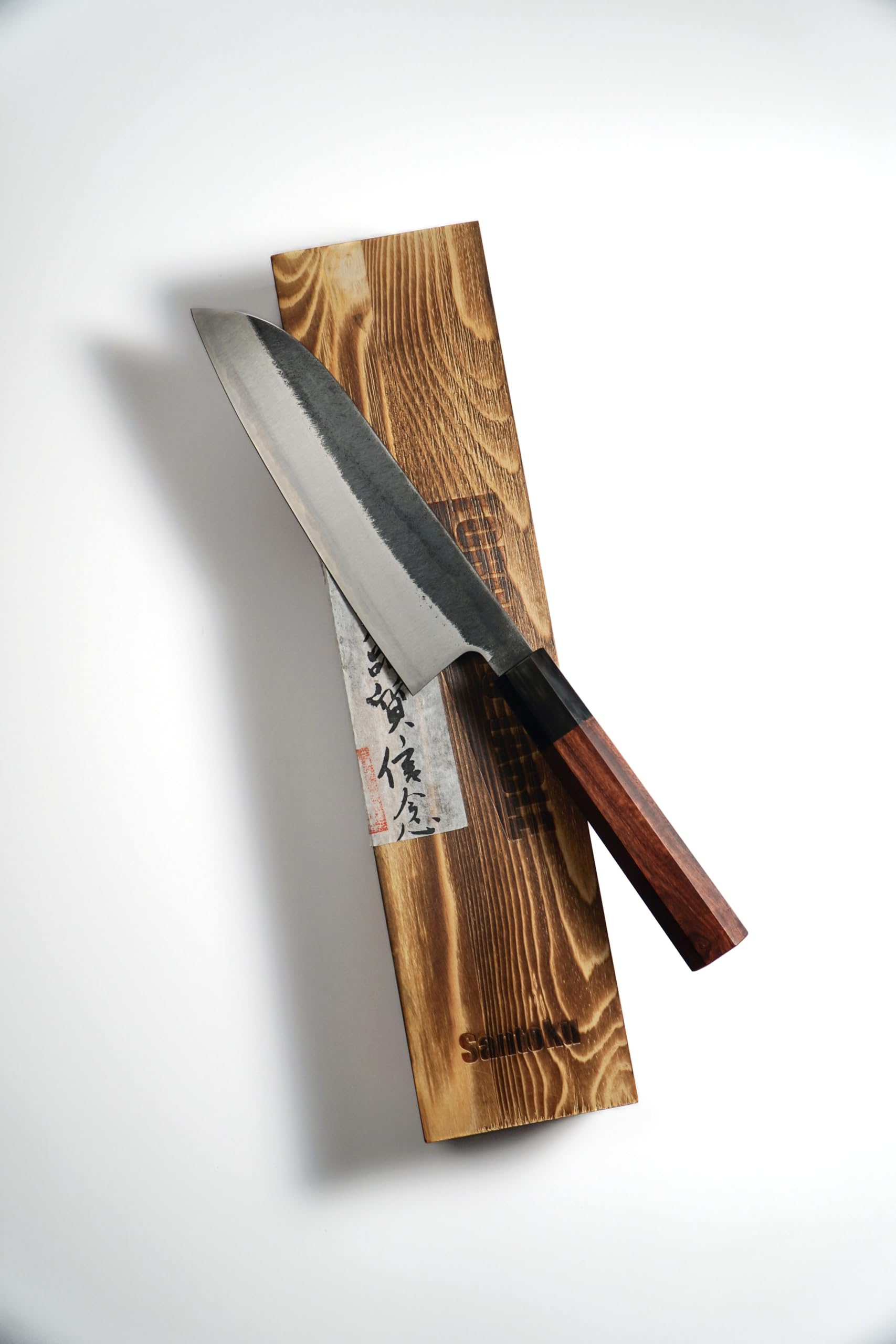 Octagonal rosewood handle on santoku knife